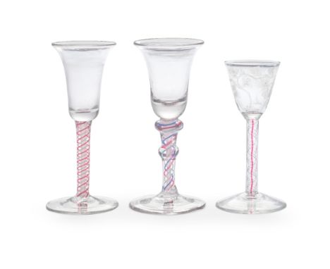 Three colour twist wine glasses, circa 1765 and laterComprising two Dutch examples in soda glass, both with bell bowls, one o