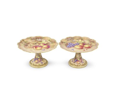 A pair of Royal Worcester 'Painted Fruit' comports or cake stands by John Freeman, circa 1960The wavy gadrooned rims and moul