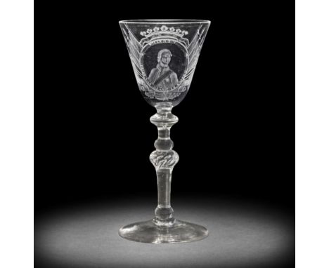 A rare Dutch engraved Royal portrait light baluster wine glass, circa 1766-70The round funnel bowl with a half-length portrai