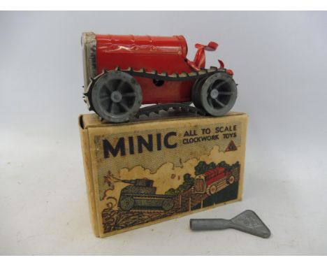 A boxed Tri-ang Minic Caterpillar tractor with key.