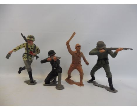 Four unusual Marx plastic large scale soldiers, three in WWII German uniforms, the other a WWII Japanese officer.