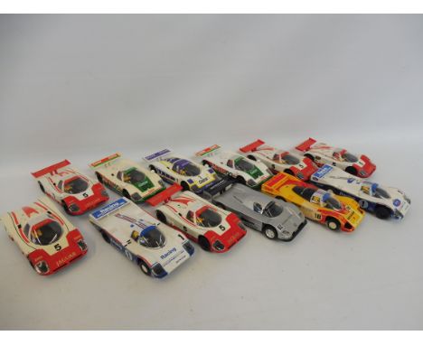 A selection of Scalextric slot cars, including Jaguar, Porsche, Mercedes etc.