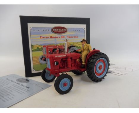 A boxed Britains home farm series David Brown 900 tractor.