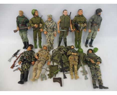A quantity of Action Man figures, dragons and others, uniforms and accessories.