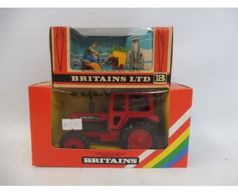 A Britains 9521 Volvo tractor in rainbow pack with a 9552 Transplanter.