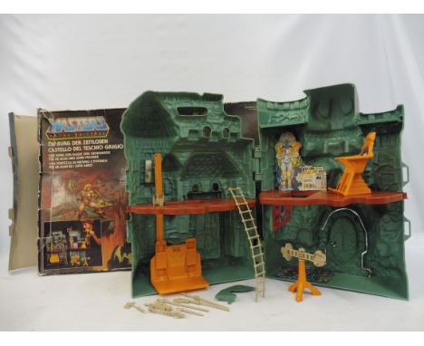 A Mattel boxed Masters of the Universe Castle Grayskull set, castle appears in good condition although some small pieces miss