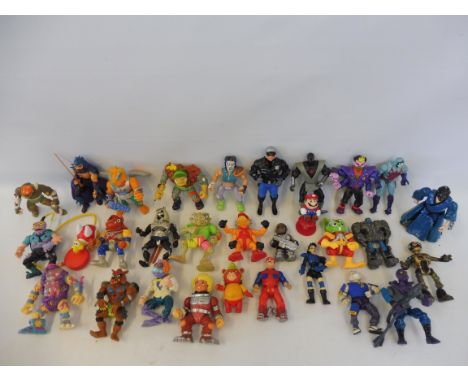 A box of later release action figures to include Ghostbusters, He-Man etc. 