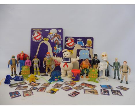 A box of original Real Ghostbusters loose action figures including Ray Stans, Marshmallow Man, Proton Blasters, Ecto-plasm, t