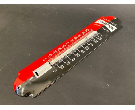 A modern Champion Spark Plugs enamel thermometer, 2 1/2 x 11 3/4". 