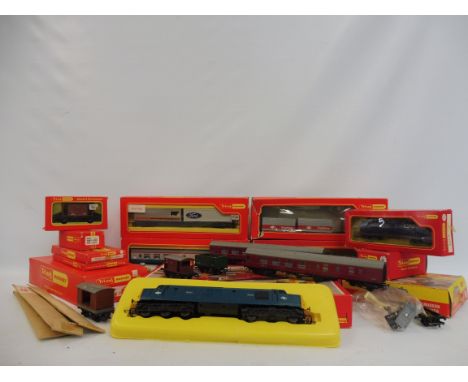A quantity of Tri-ang Hornby rolling stock, carriages, an engine shed, a Freightliner depot container, a Diesel locomotive et