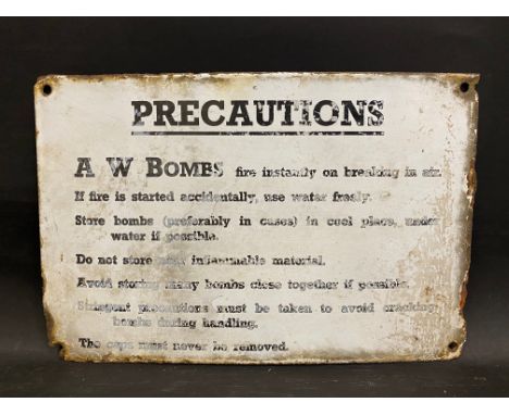 A 'Precautions Bombs...' rectangular enamel sign, 12 x 8".