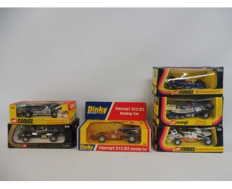 Five boxed Corgi Formula 1 racing cars and a boxed Ferrari 312 racing car.