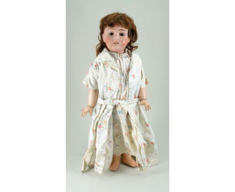 J. Verlinque bisque head doll, French circa 1915, with fixed brown glass eyes, painted lashes and brows, open mouth with uppe