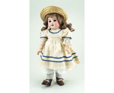 French bisque head doll, probably Eden Bebe, French circa 1910, with fixed brown glass eyes, feathered brows, open mouth and 