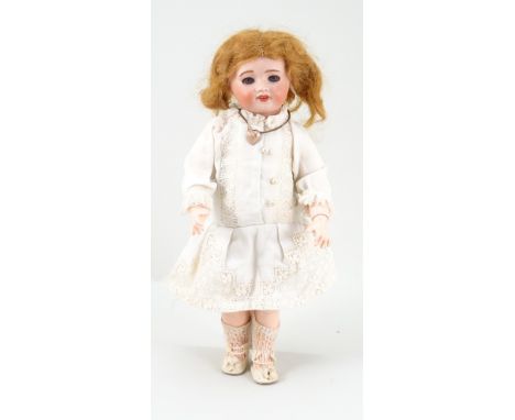 Unis France 60 Bleuette bisque head doll, French circa 1910, with weighted blue glass eyes, real lashes, open mouth with uppe