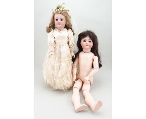 S.F.B.J 60 bisque head doll, French, circa 1910, with weighted brown glass eyes, painted lashes and raised brows, open mouth 
