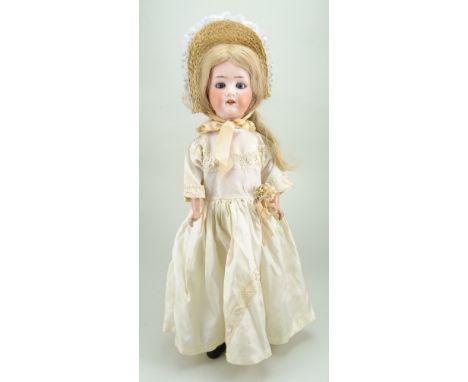 Heubach Koppelsdorf 250 bisque head doll, German circa 1915, with weighted blue glass eyes, open mouth with upper teeth and l