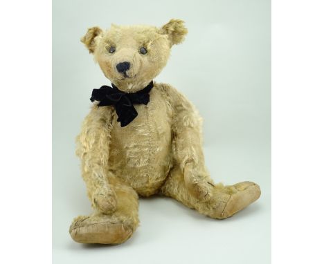 Early Steiff Teddy bear, German circa 1909, the straw filled light brown mohair bear with black boot button eyes, pointed muz