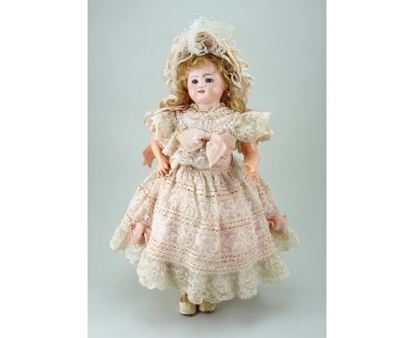 Beautiful all original Bebe Gigoteur Kicking Steiner bisque head doll, circa 1880, with fixed blue glass eyes, finely painted