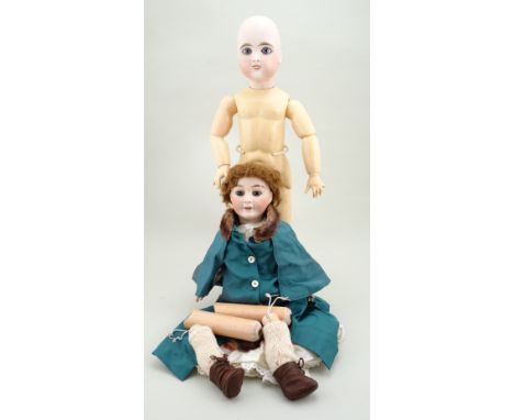 Limoges ‘Favorite’ bisque head doll, French circa 1915, with fixed brown glass eyes, painted lashes and brows, open mouth wit