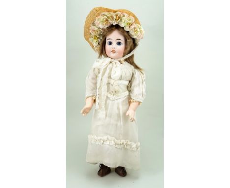 French bisque head doll, probably Jullien, French circa 1900, with fixed blue glass eyes, finely painted lashes and brows, op