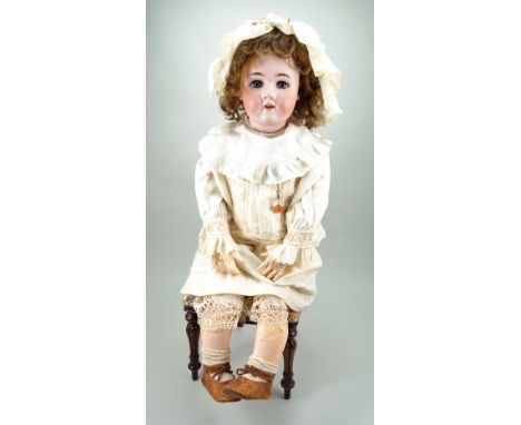 Large Handwerck 109 bisque head doll, German circa 1910, with weighted blue glass eyes, real lashes, raised eyebrows and open