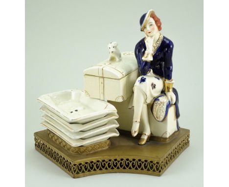 Hinode (Japan) glazed china seated Lady with trunk and ashtrays table smokers companion, 1920s, lady seated on a trunk wearin