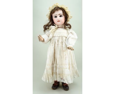 Tete Jumeau bisque head Bebe doll, size 10, French circa 1890, fine pale bisque head with fixed brown glass paper-weight eyes