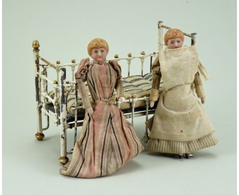 Marklin painted metal cot, German circa 1905, painted in cream and gold, with sliding side panel to each side and original ma