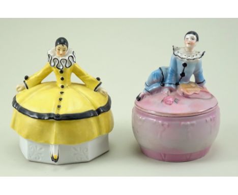 Two glazed china Pierrot and Pierrette dressing table boxes, 1920s, pink circular base and lid with seated Pierrot in blue, i