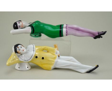 Pair of glazed china reclining Beauty and Pierrot half-dolls, beauty with hands behind her head, black bobbed hair, finely pa