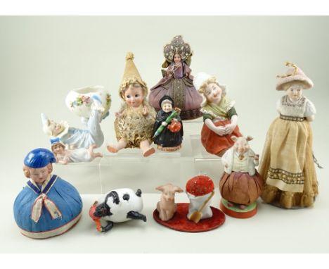 Collection of bisque figurines, pin cushions include Schaefer Vater gentleman pig, 4 ¼” (11cm) high, pig and sack mounted on 