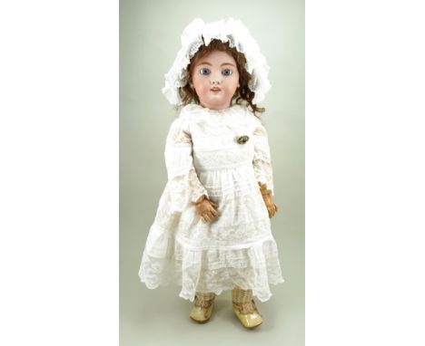 Tete Jumeau  DEP bisque head doll,  French circa 1910, with fixed blue glass eyes, painted lashes and feather brows, open mou