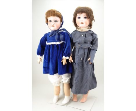 A.M 390 bisque head dolls, German circa 1910, with weighted blue glass eyes, painted lashes and brows, open mouth with upper 