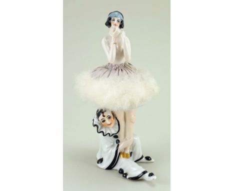 Glazed china Pierrot and Flapper dressing table powder dish, 1920s, seated Pierrot in white suit with black pom-poms and edgi