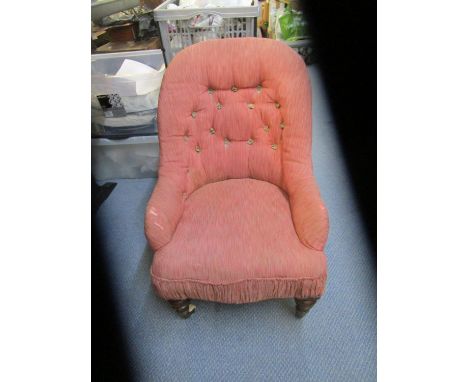 A Victorian mahogany child's upholstered chair, turned front legs on ceramic castors, button back 