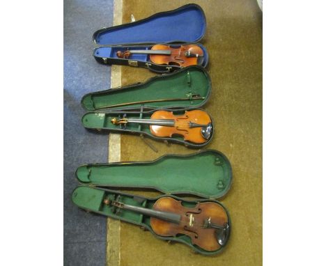 Three early 20th century violins in cases, one with a bow, another with label for Antonius Stradivarius Cremonenis 