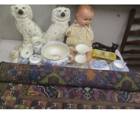 A mixed lot to include a Middle Eastern rug, vintage doll, photo cards and miscellaneous ornaments to include Wedgewood Jaspe