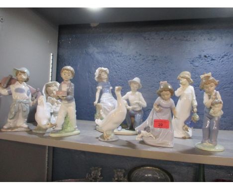 A collection of nine Nao porcelain figures, to include examples modelled as children, maidens and ducks 