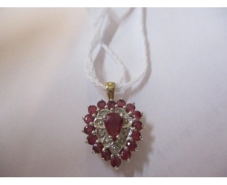 A gold, ruby and diamond heart shaped pendant, stamped 575, total weight 2.1g 