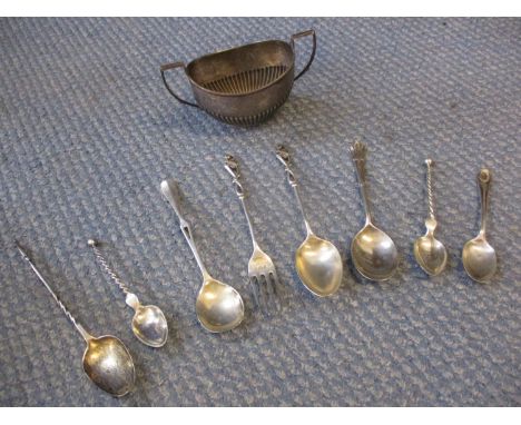 A quantity of silver items to include a twin handled sugar bowl and mixed spoons and a fork, total weight 210g 