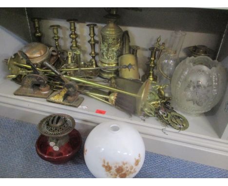 A mixed lot to include brass fire implements, brass candlesticks, oil lamp with shade, two Victorian seal presses and other i