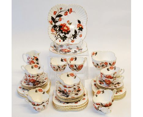 FORTY PIECE LATE VICTORIAN FLUTED CHINA TEA SERVICE FOR 12 PERSONS, printed and painted with flowers, heightened in gilt,  pr