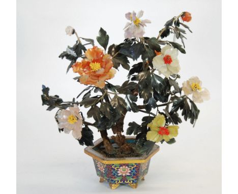 A CHINESE MODEL OF A FLOWERING SHRUB with dark green hardstone leaves and coloured hardstone flowers, in a cloisonne enamelle