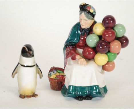 ROYAL DOULTON CHINA FIGURE, 'THE OLD BALLOON SELLER' HN 1315, 7 3/4" (19.7cm) high and a ROYAL DOULTON MODEL OF A PENGUIN, HN