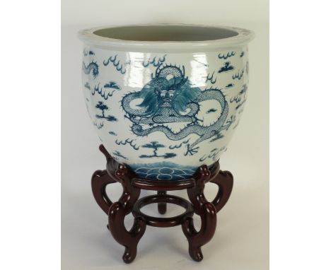 A TWENTIETH CENTURY CHINESE PORCELAIN FISH BOWL, painted in underglaze blue with three coiled five clawed dragons, a flaming 