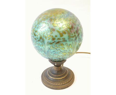 ART DECO STYLE PATINATED METAL TABLE LAMP with iridescent blue glass globular shade and circular base, 10" (25.4cm) high 