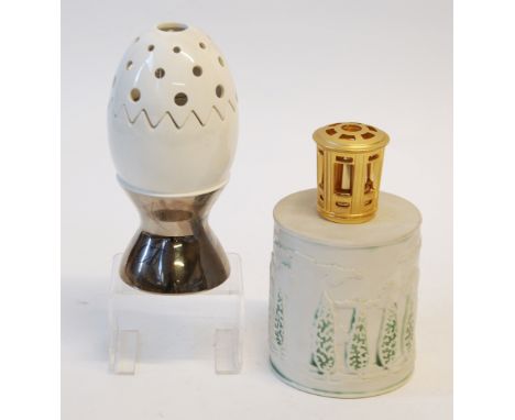 BERGER, PARIS, ESSENCE LAMP IN THE FORM OF A TWO PART CRACKED EGG  IN AN EGG CUP, the body after a design by Chantel Thomass,