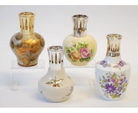 THREE BERGER, PARIS ESSENCE LAMPS, the variously shaped ceramic bodies with printed decoration of flowers, bright metal lante