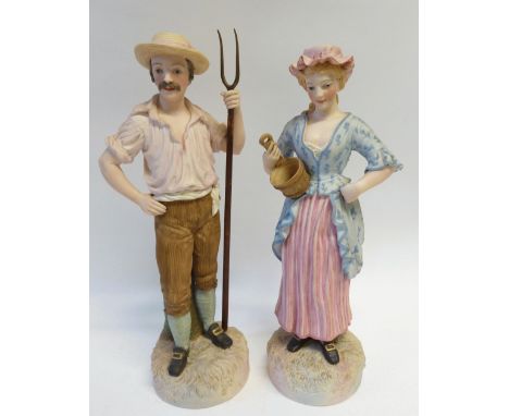 PAIR OF 19th CENTURY TINTED BISQUE FIGURES BY ROBINSON AND LEADBETTER modelled as a maid and her companion, he with pitchfork